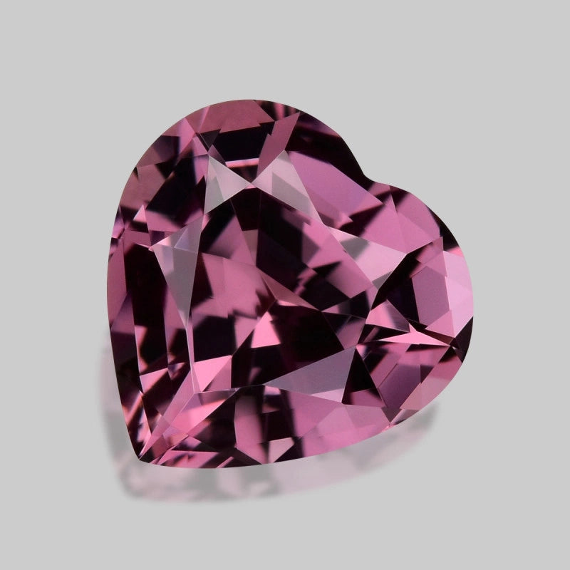Mesmerising custom precision heart-cut purple Mahenge spinel.