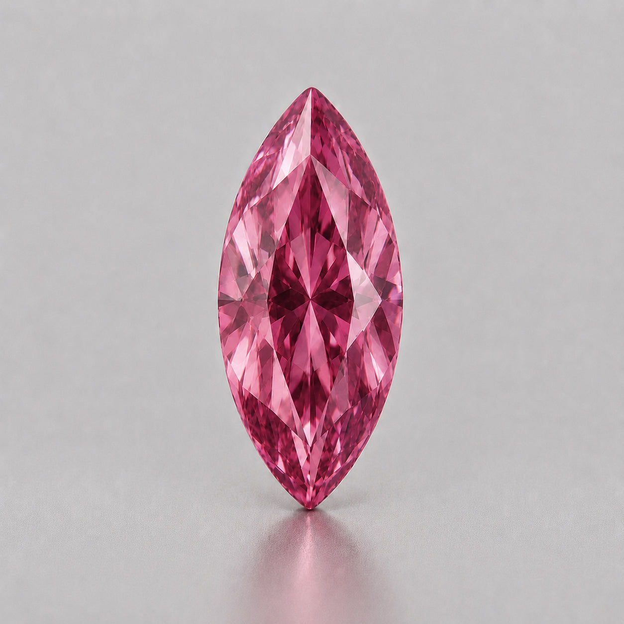 Unheated, precision marquise-cut reddish pink sapphire.
