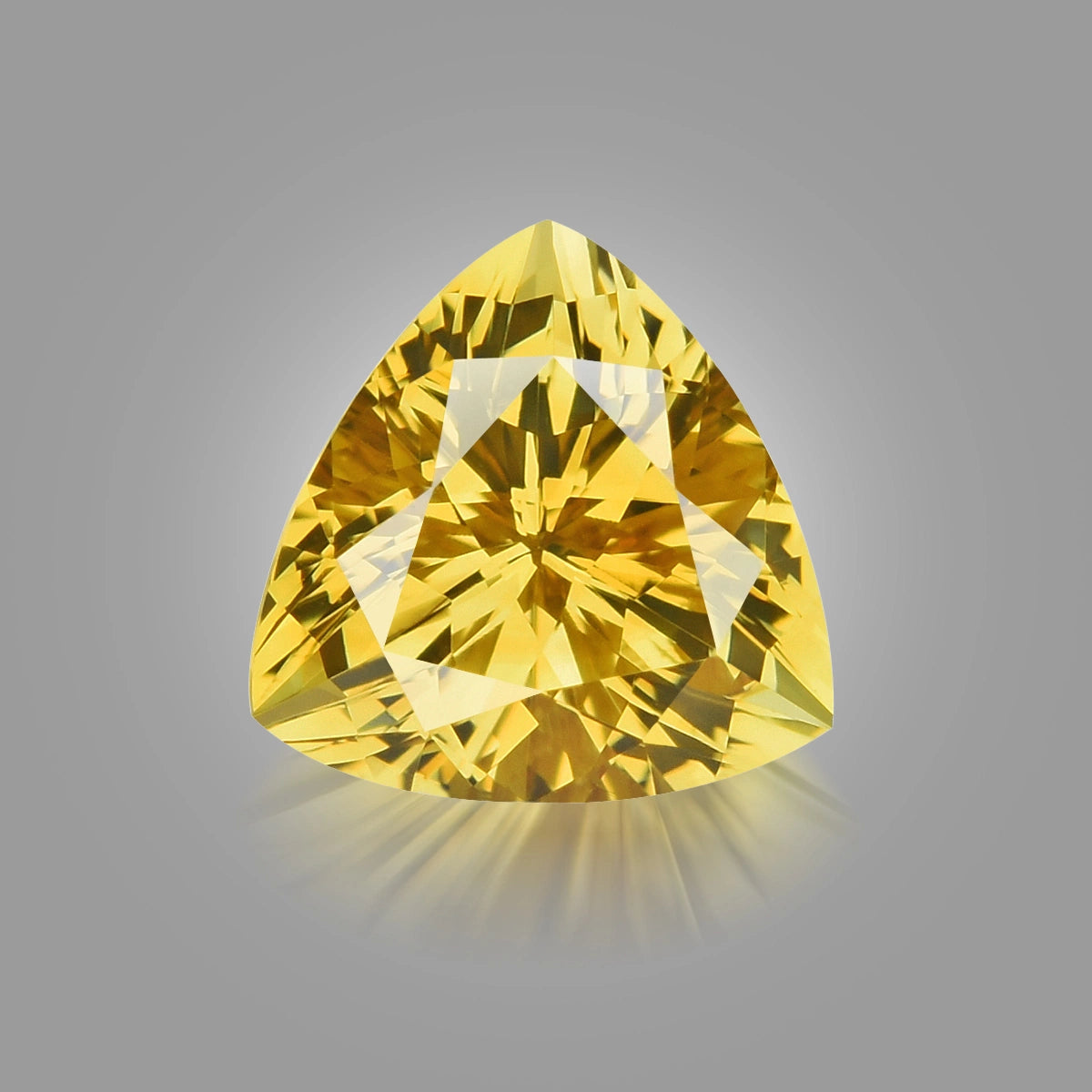 Loupe Clean, fiery precision trilliant-cut yellow zircon.
