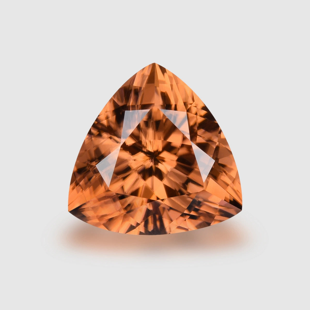 Loupe Clean, precision trilliant-cut Imperial garnet.