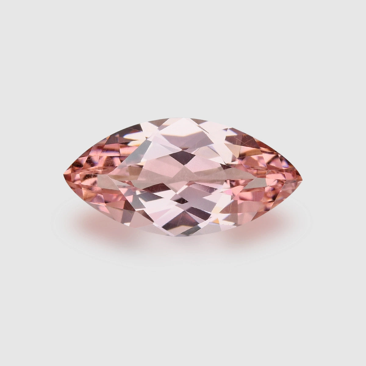 Loupe Clean, custom precision marquise-cut Imperial garnet.