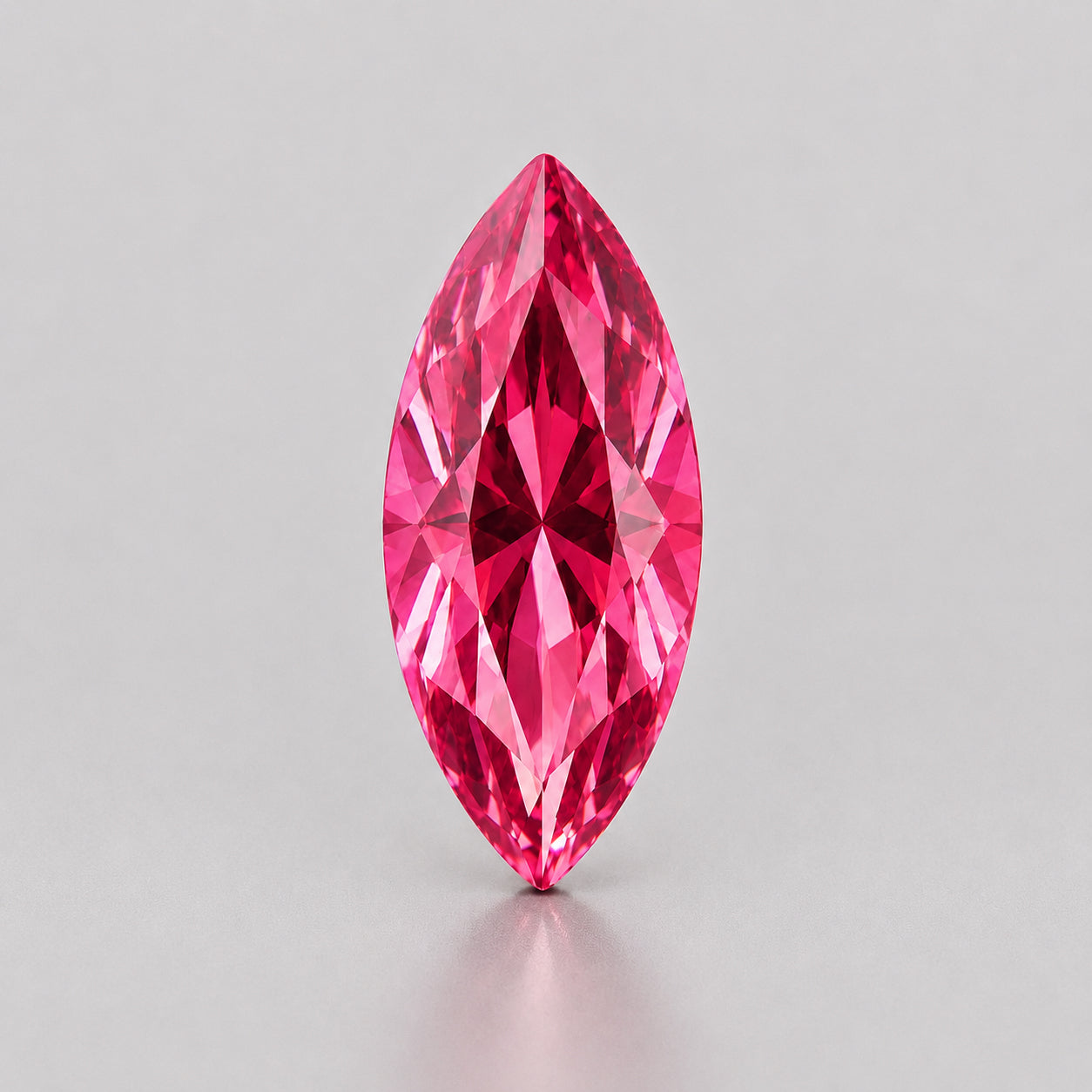 Unheated, precision marquise-cut reddish pink sapphire.