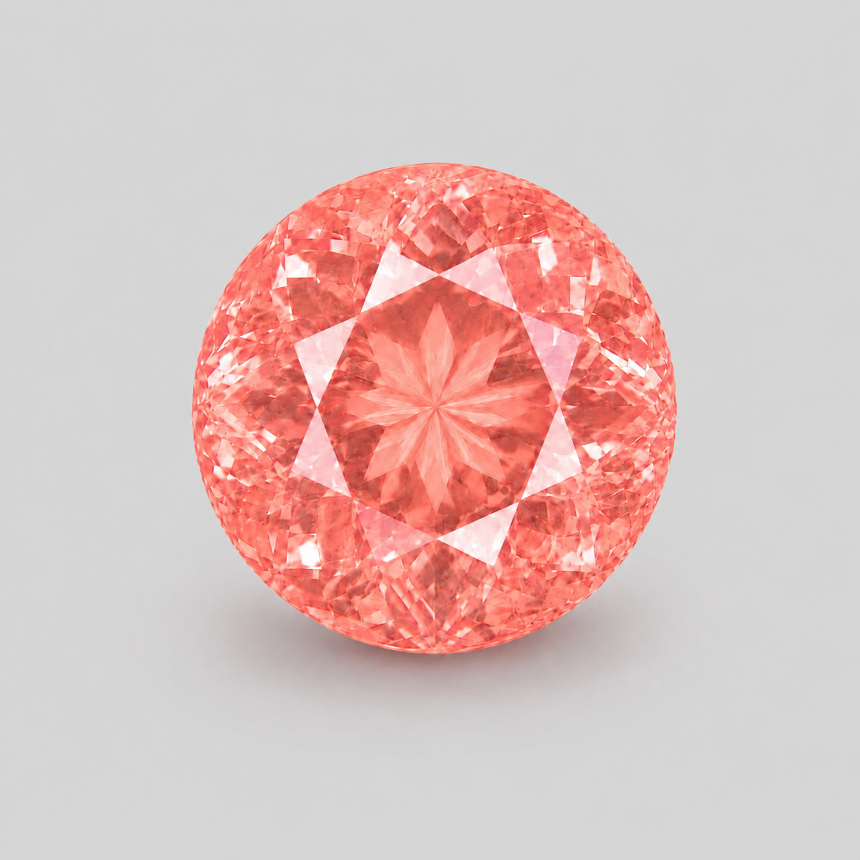 Unique orangey pink, precision-cut Mahenge spinel.