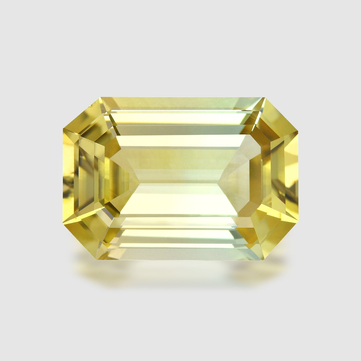 Precision emerald-cut yellowish green tourmaline.