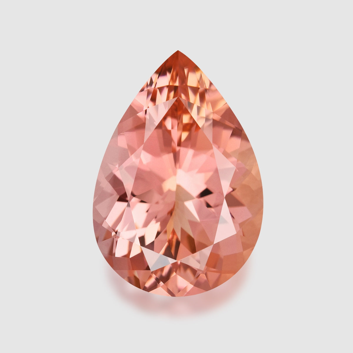 Precision pear-cut orangey pink tourmaline.