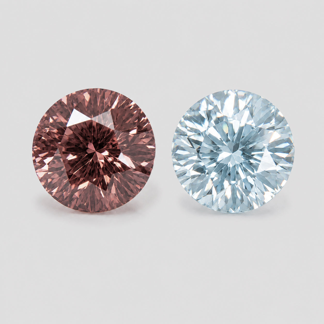 Brilliant reverse pair of light blue aquamarine & zircon.