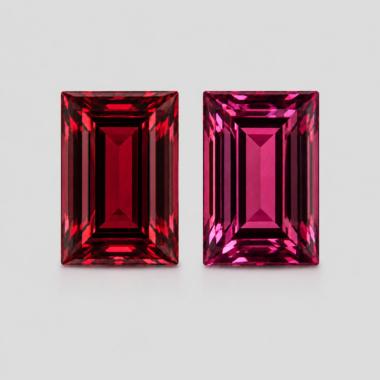 Reverse-pair orangey red & pinkish red Mahenge garnet.