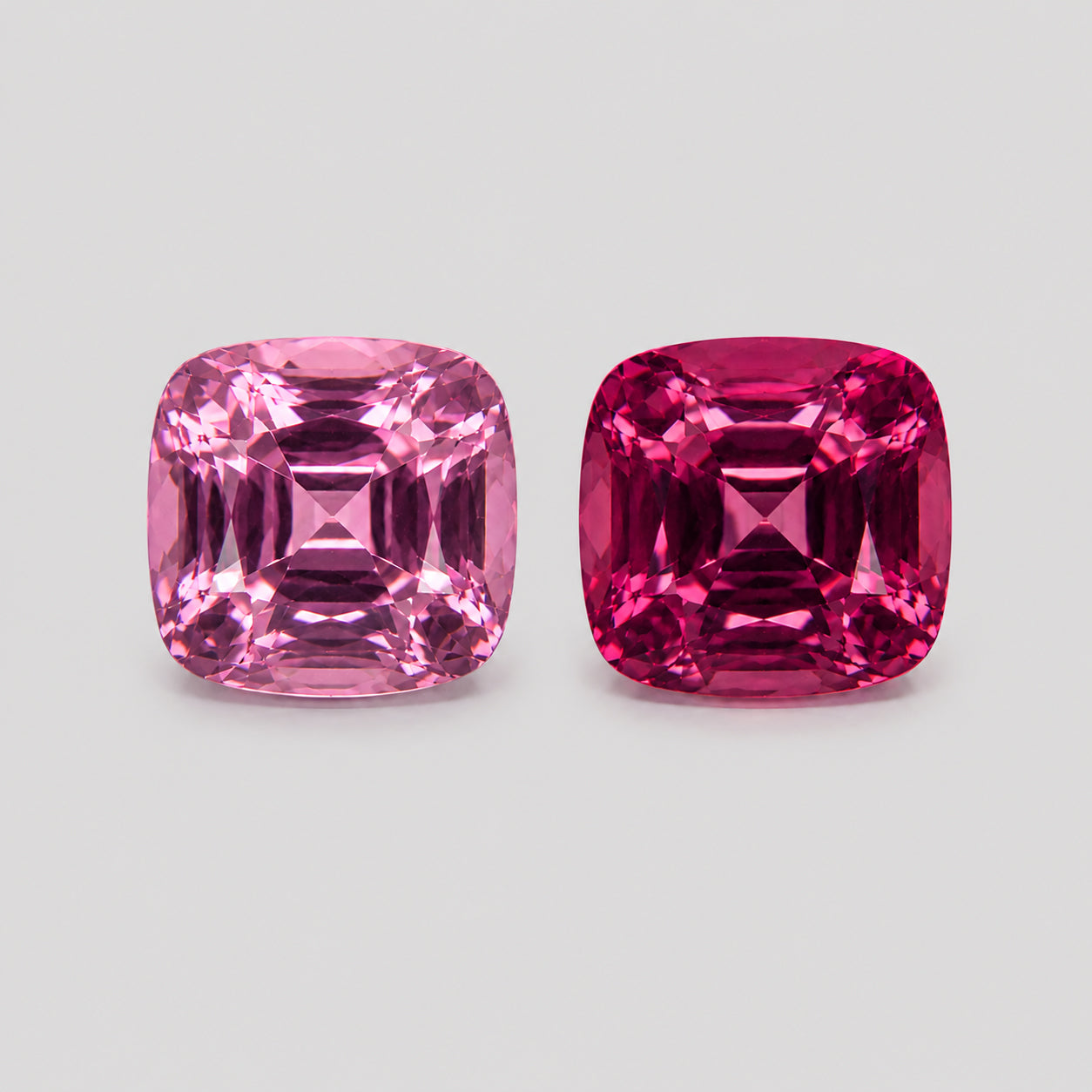 Reverse-pair purplish rose & pink Mahenge garnet.