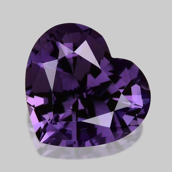 Exquisite, custom precision-cut lustrous rich bright purple spinel.