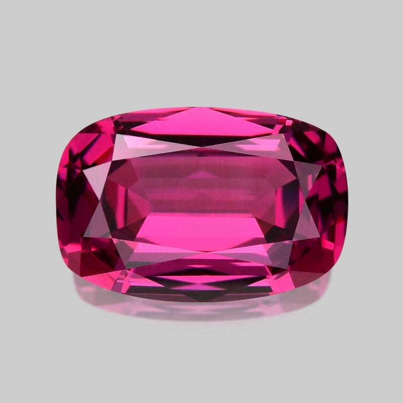 Exquisite natural neon pinkish red Mahenge garnet.