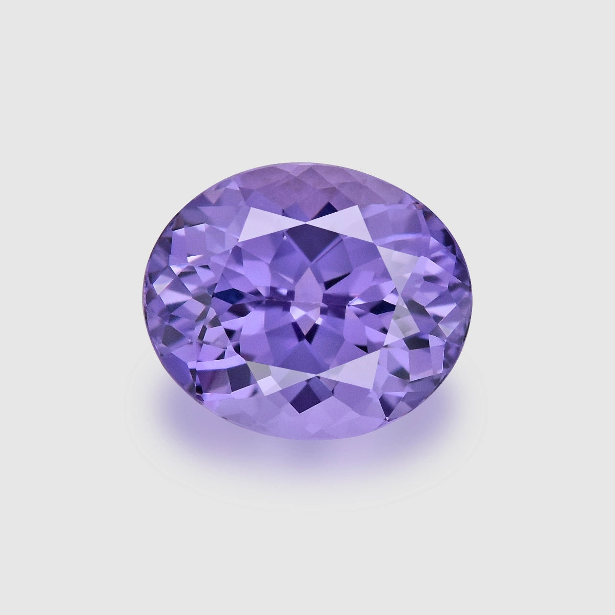Loupe Clean, custom Portuguese oval-cut, neon violet spinel.