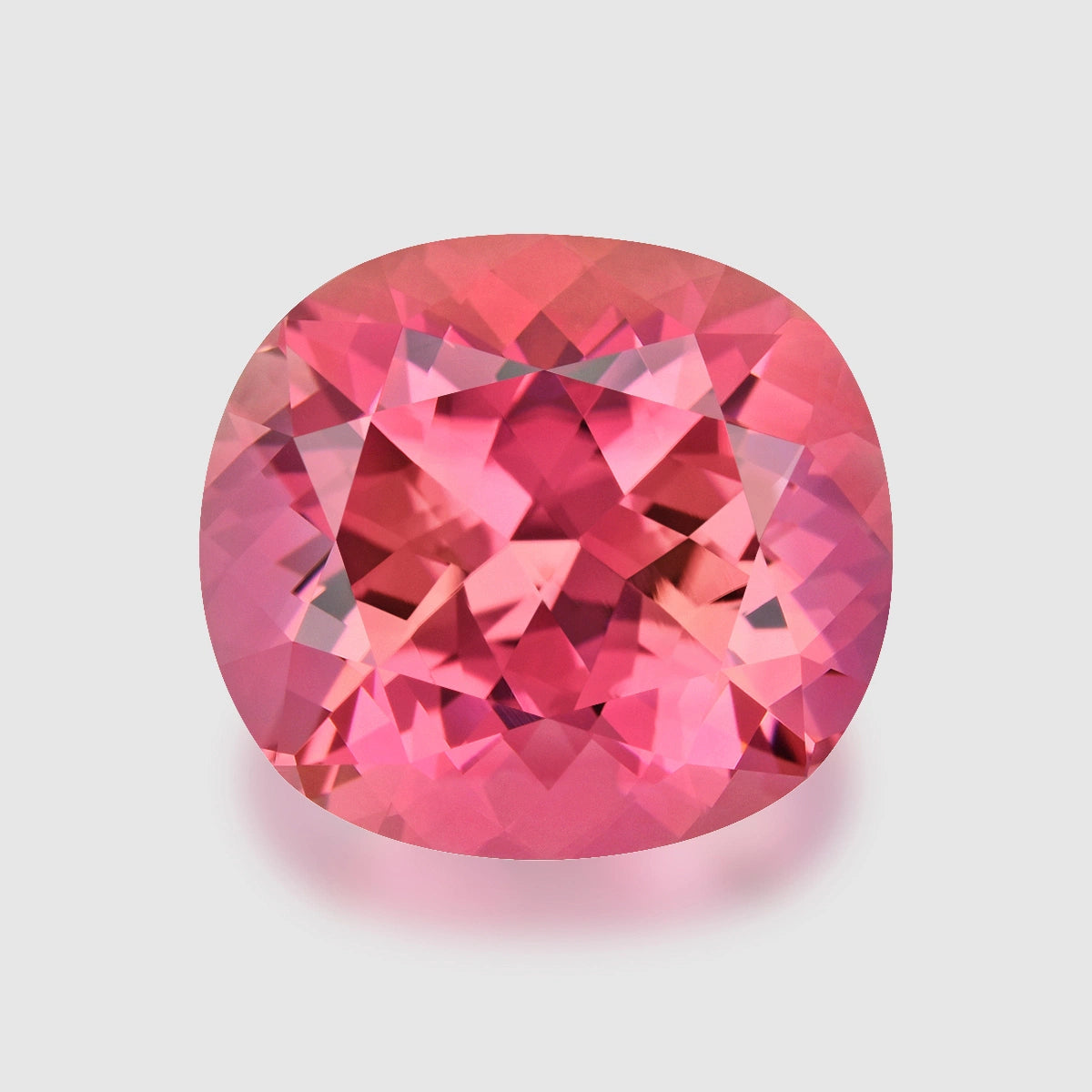 Loupe Clean, precision cushion mix-cut neon pink tourmaline.