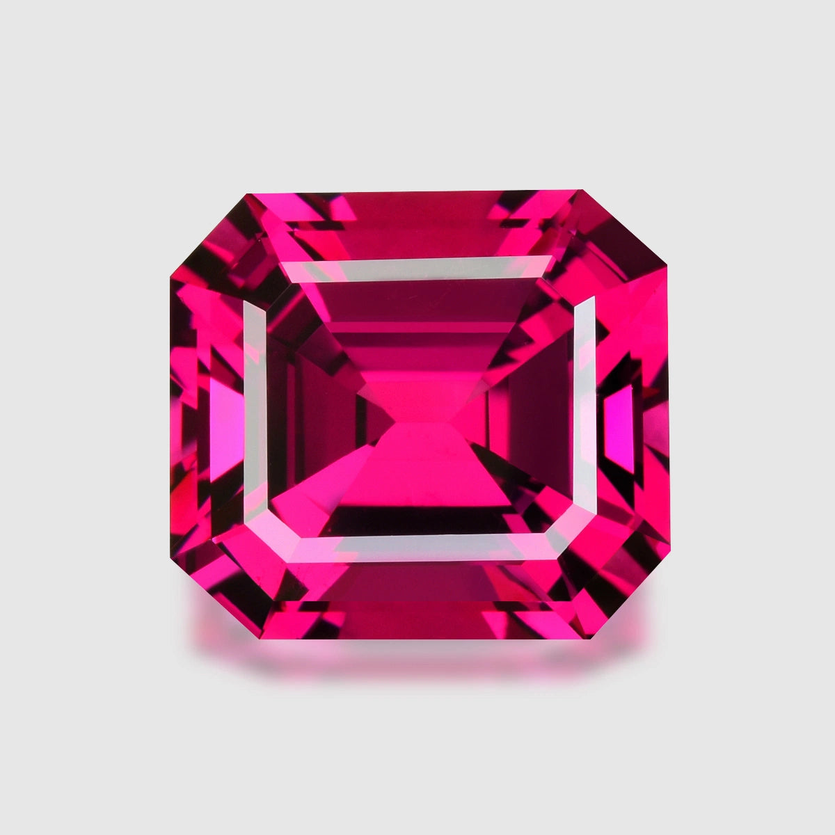 Loupe Clean, precision radiant-cut purplish red Umbalite garnet.