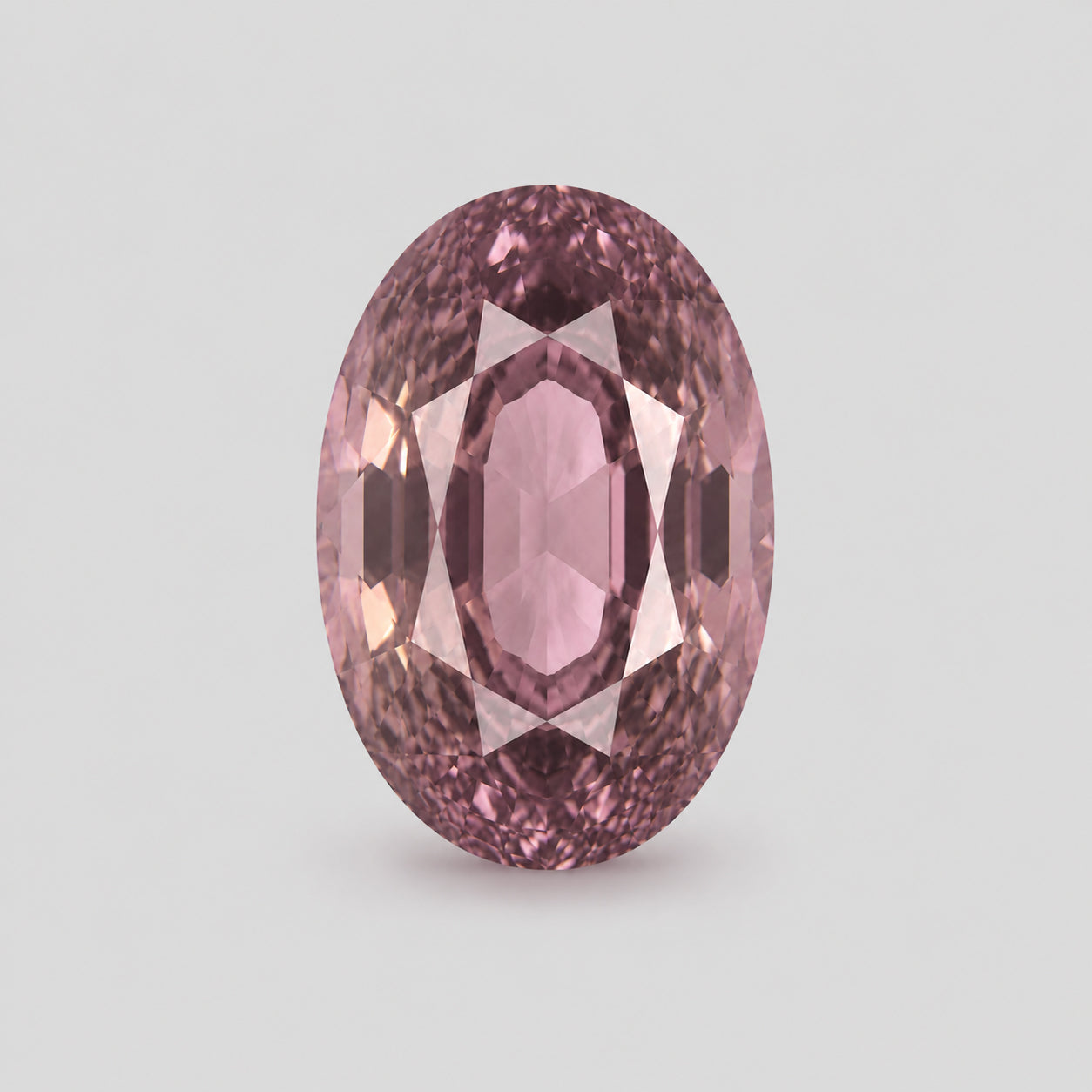 Unheated, custom precision-cut salmon pink sapphire.