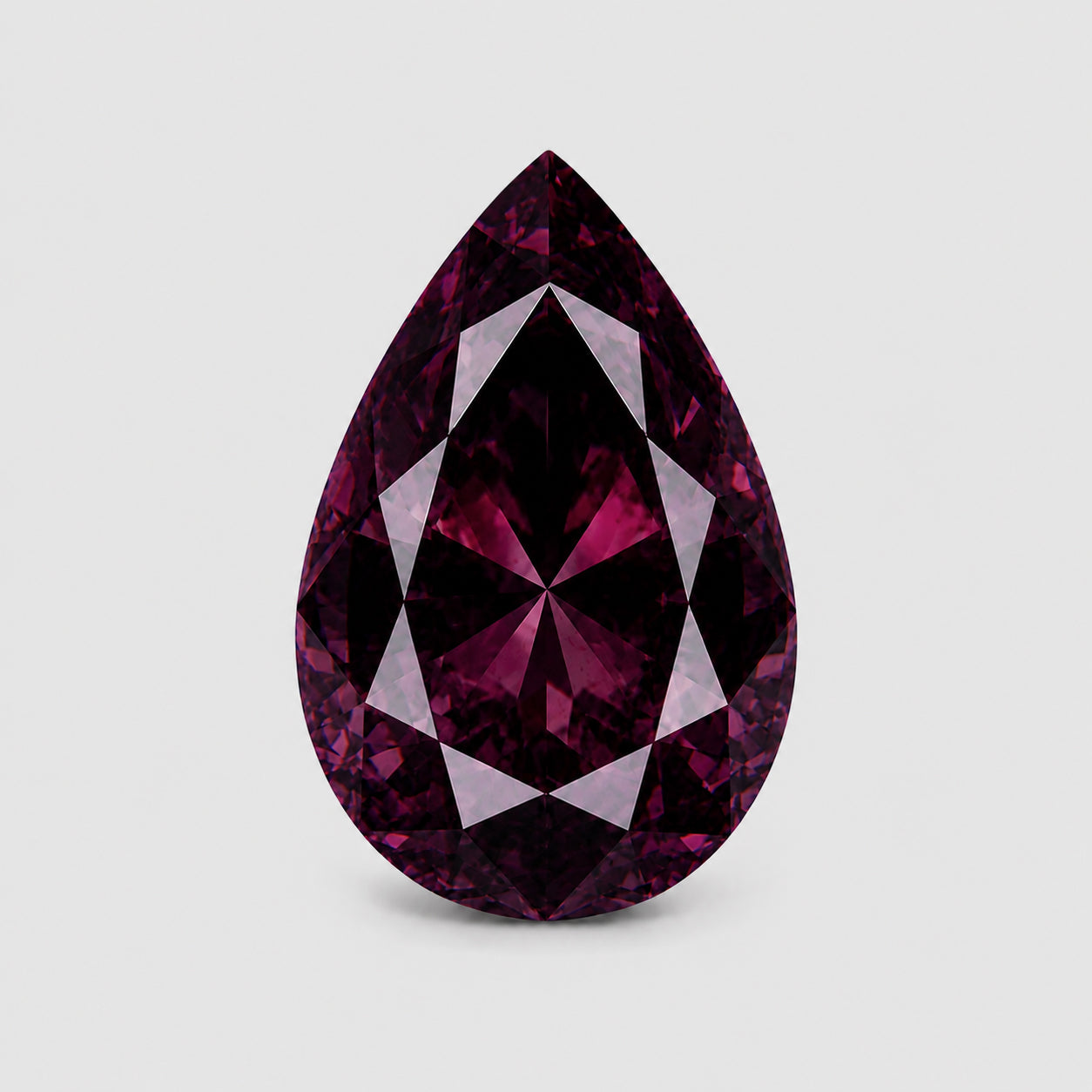 Unheated precision pear-cut rich purple Umba sapphire.