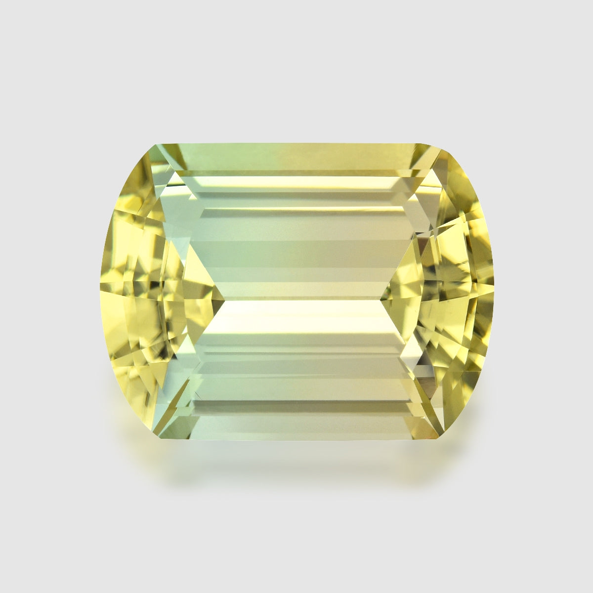 Loupe Clean, precision cushion-cut yellowish green tourmaline.