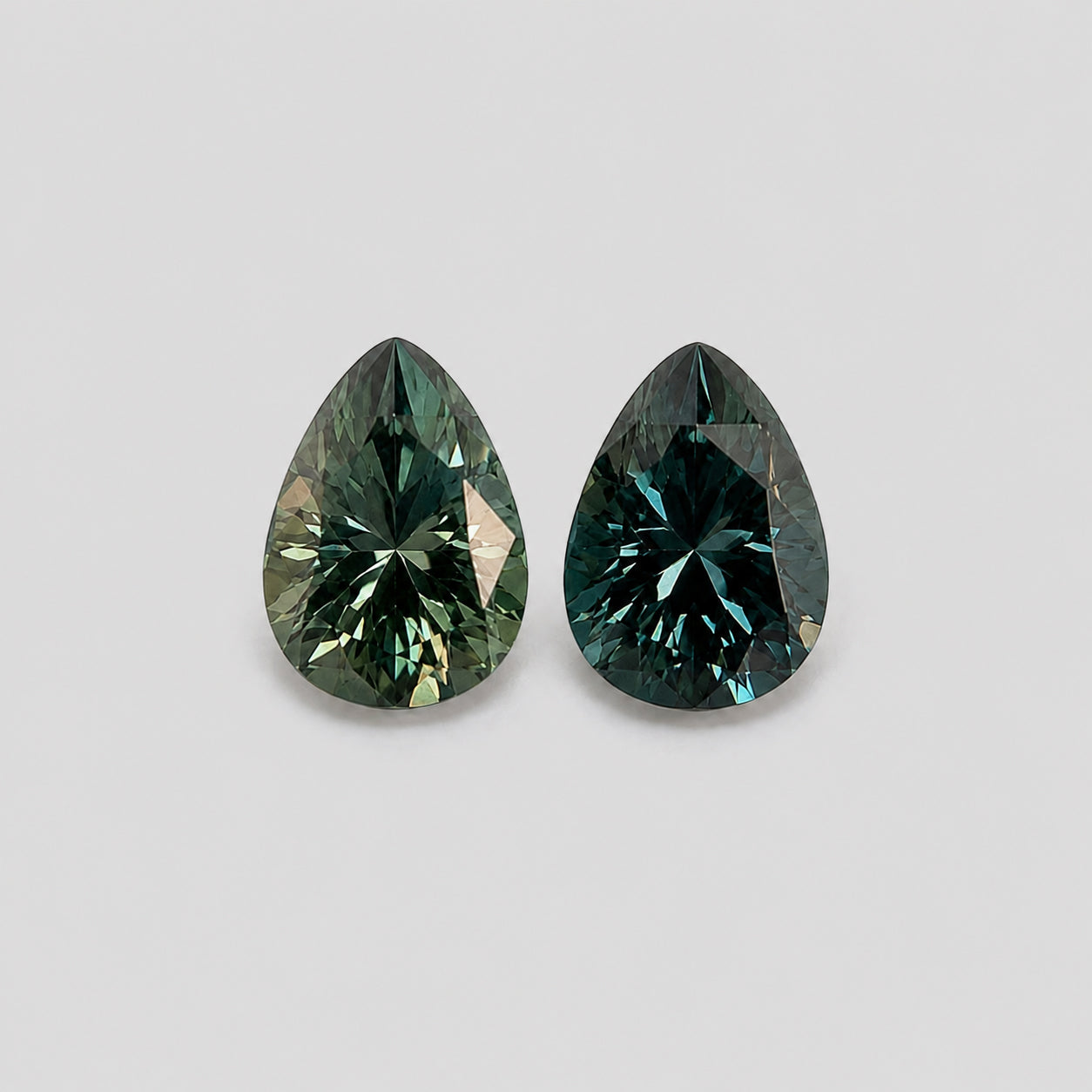 Unheated teal blue & green sapphire reverse-pair.