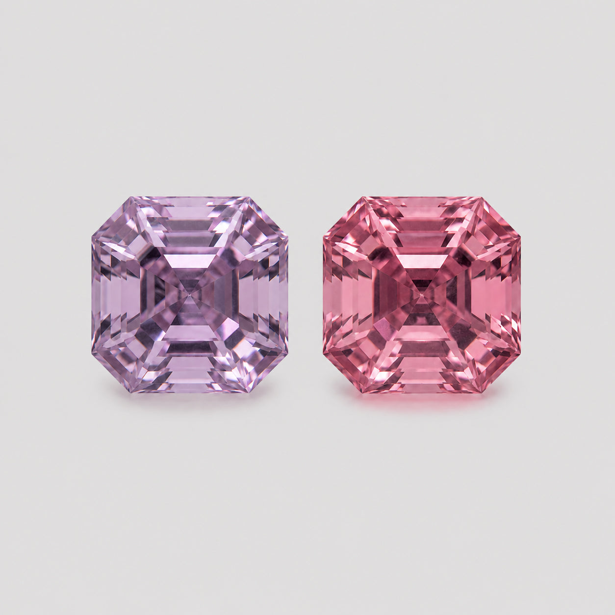 Precision-cut reverse pair pink & purple Mahenge spinel.