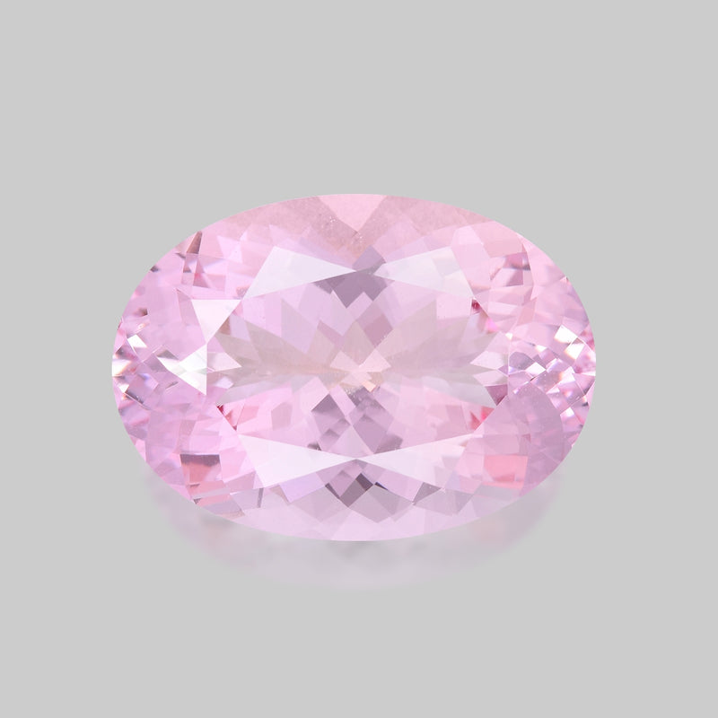 Exquisite, custom precision oval-cut neon pink morganite.