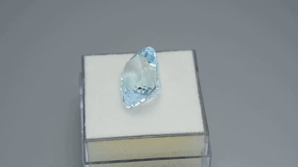 Flawless, custom precision cushion-cut neon blue aquamarine.