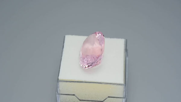 Exquisite, custom precision oval-cut neon pink morganite.