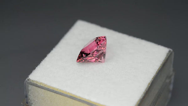 Unique gem, kite-cut fiery neon pink tourmaline.