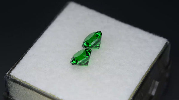 High gem precision-cut matching pair vivid green tsavorites.