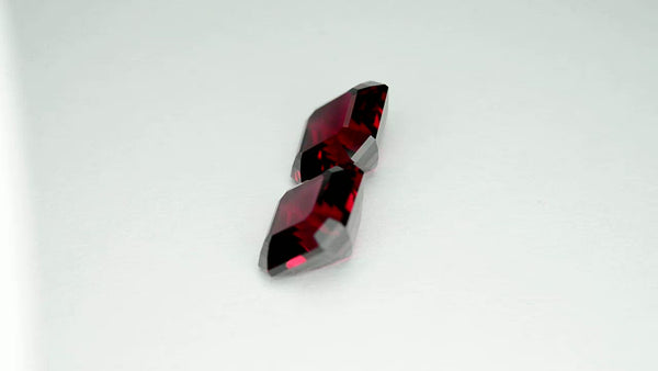 Flawless matching pair, precision-cut red Mahenge garnets.