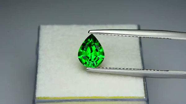 High gem, custom precision-cut vivid green tsavorite garnet.