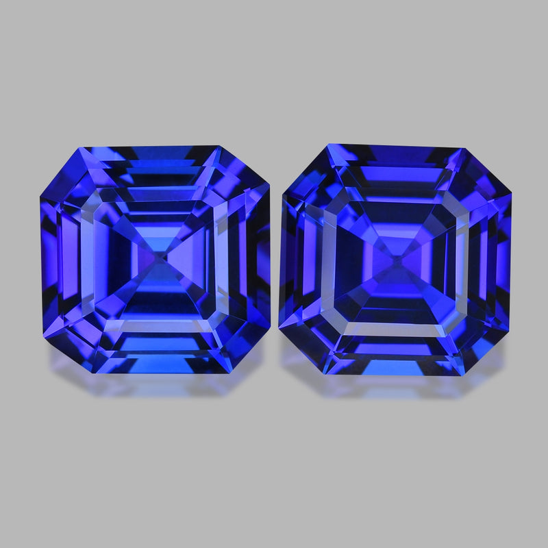 Flawless asscher pair, custom precision-cut purplish blue tanzanites.