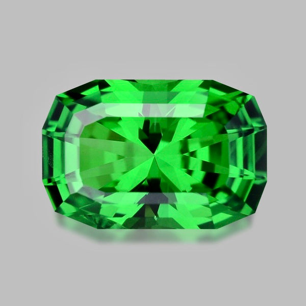 Semi-long custom cushion shaped Tsavorite garnet.