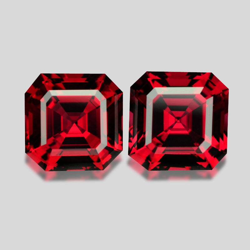 Flawless matching pair, precision-cut red Mahenge garnets.