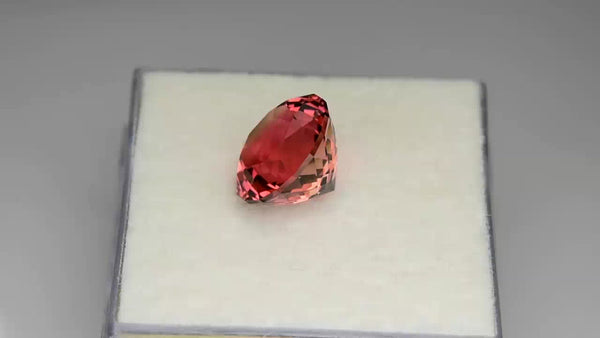 Brilliant custom round-cut Namibian orangey pink tourmaline.