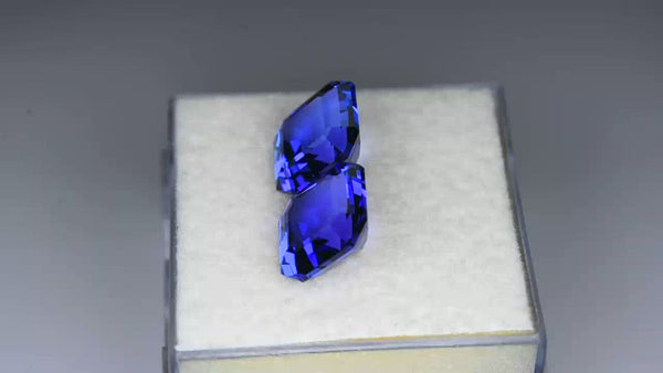 Flawless asscher pair, custom precision-cut purplish blue tanzanites.