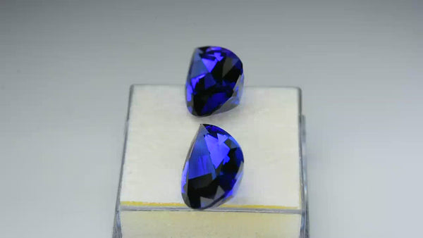 Flawless matching pair, neon purplish blue tanzanites.